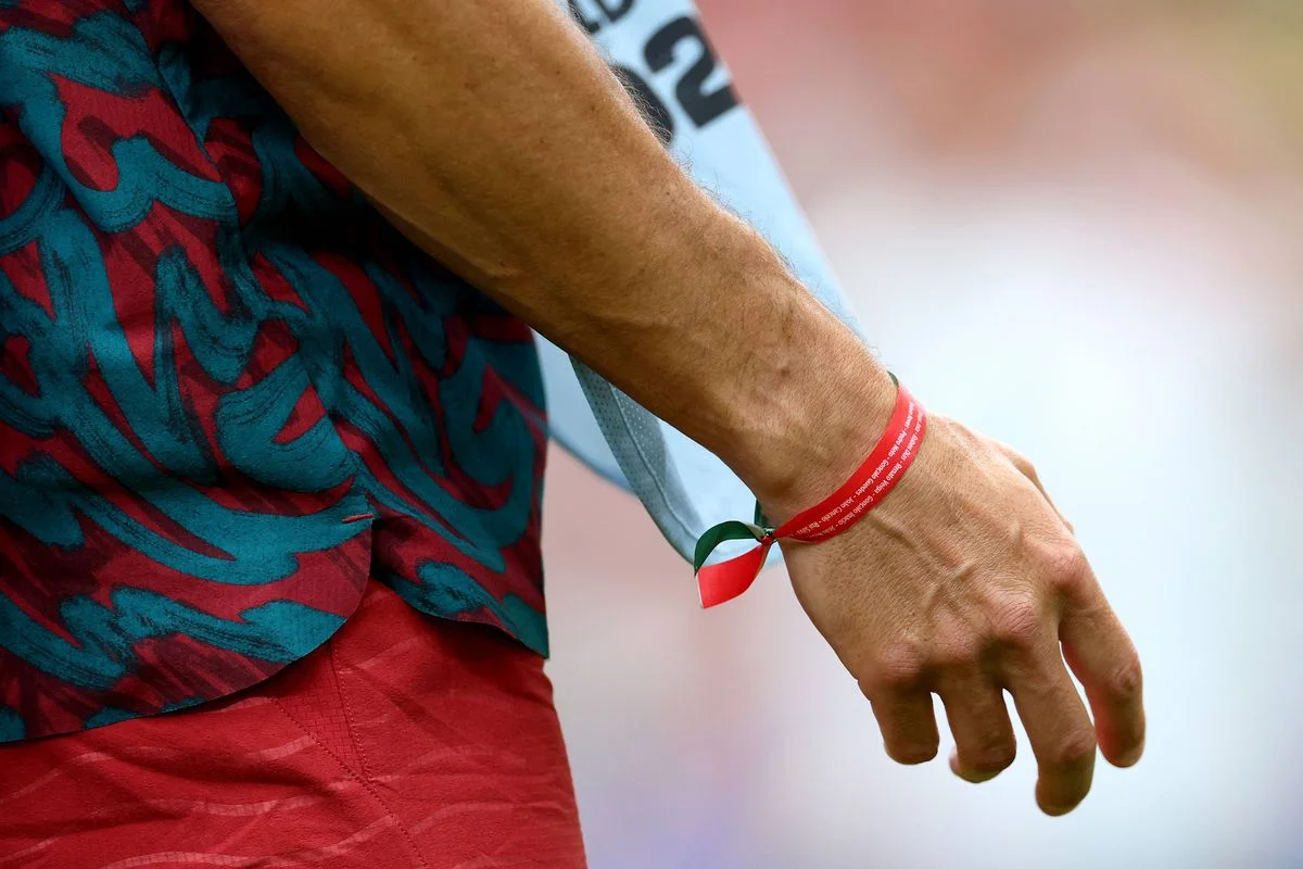 A detailed view of the bracelet on the wrist of Cristiano Ronaldo #7 of Portugal (obscured), which is a tribute to former Portuguese international footballer Diogo Jota and was presented to him by the Portuguese Royal Family, as he warms up prior to the FIFA World Cup 2026 Group K match between Portugal and Uzbekistan