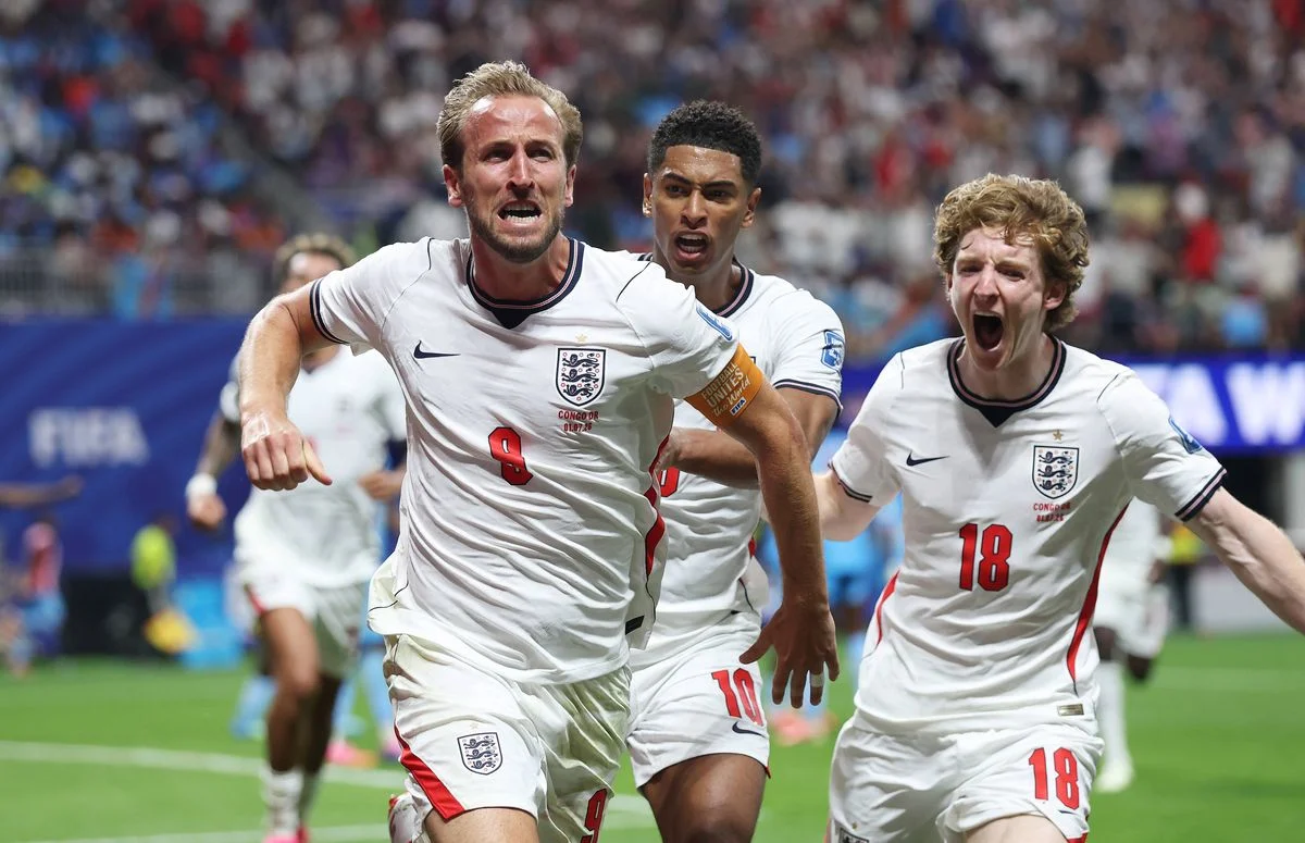 Harry Kane celebrates with Jude Bellingham and Anthony Gordon