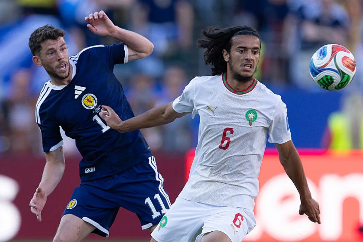 BOSTON, MASSACHUSETTS - JUNE 19:  Ryan Christie of Scotland (left) and Ayyoub BOUADDI of Morocco during the FIFA World Cup 2026 Group C match between Scotland and Morocco at Boston Stadium on June 19, 2026 in Boston, United States. (Photo by Visionhaus/Getty Images)