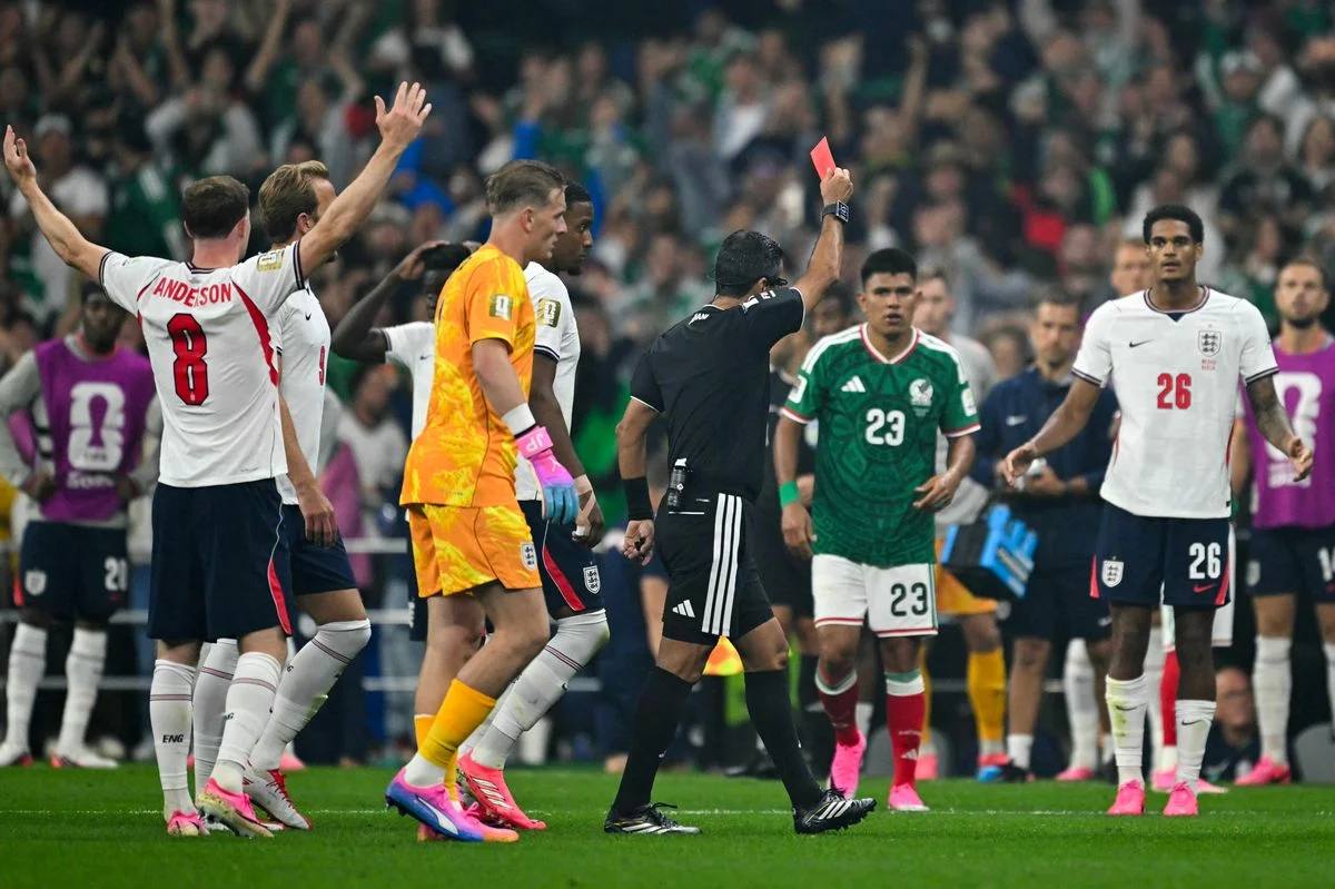 Jarell Quansah is shown a red card by referee Alireza Faghani 